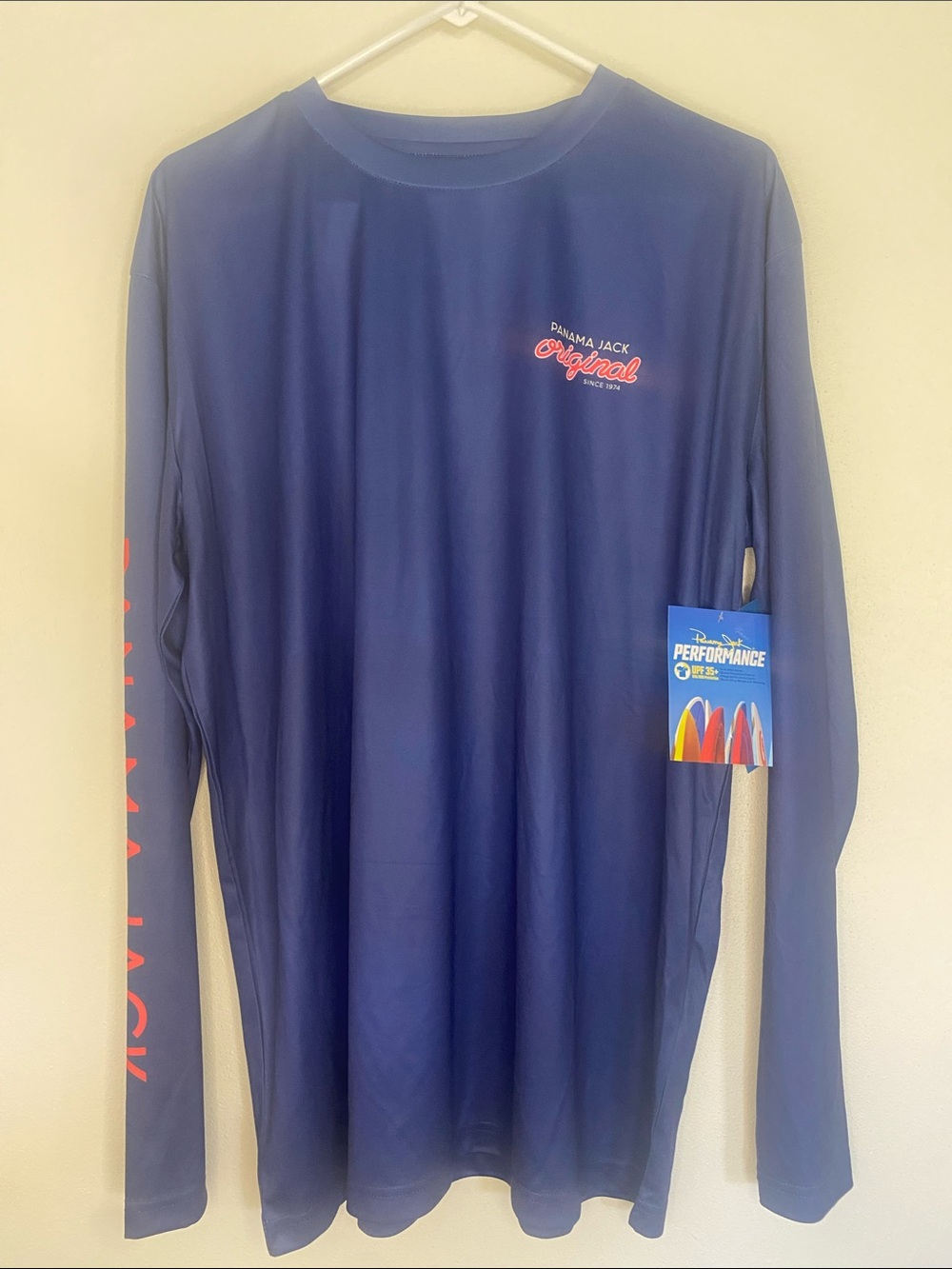 Panama Jack Navy Long Sleeve Performance Tee with Coral Accents.     Men’s Large